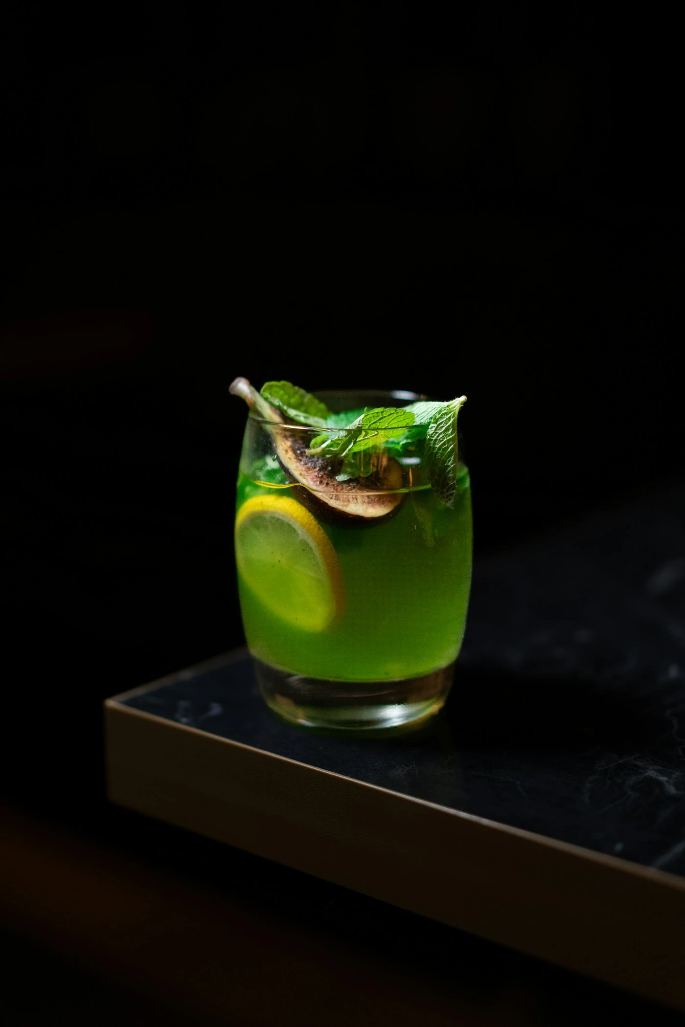 Elegant green dessert-style cocktail served cold in a coupe glass